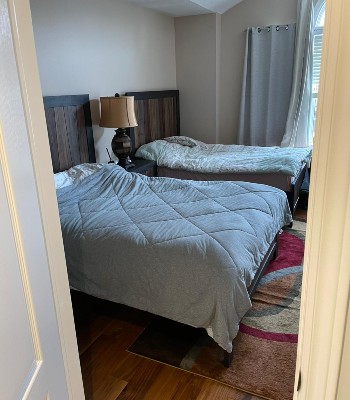 two beds with white metress